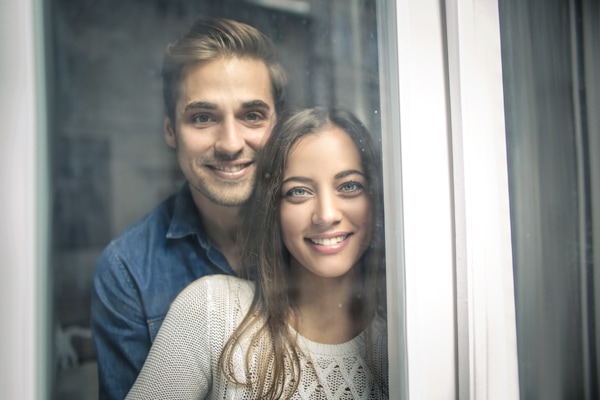 Furnace Pressure Switches, Cheerful couple looking out of the window