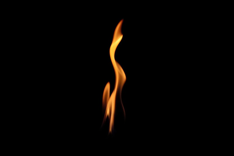 What Is That Burning Smell Coming From My Furnace? Photo of a flame in a black background.